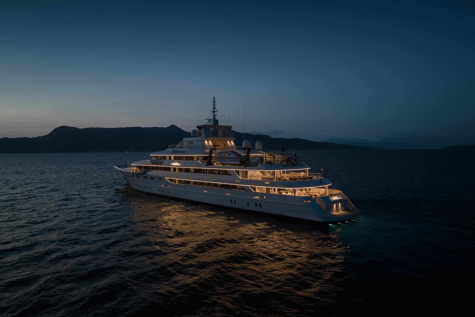 "Experience the nighttime lights and ambiance aboard the Emir superyacht with Fraser Yachts. | Emir superyacht, luxury yacht, nighttime view, Fraser Yachts"